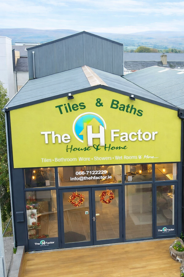 image of front of building the h factor outside of building